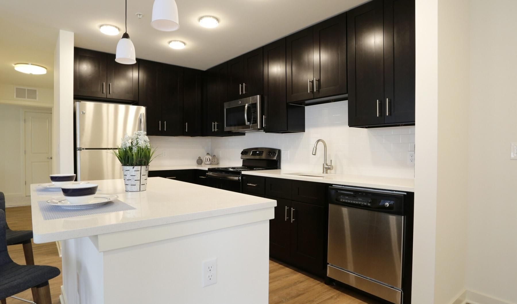 a kitchen with black cabinets