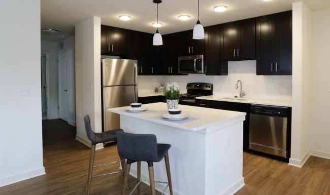 a kitchen with a table and chairs