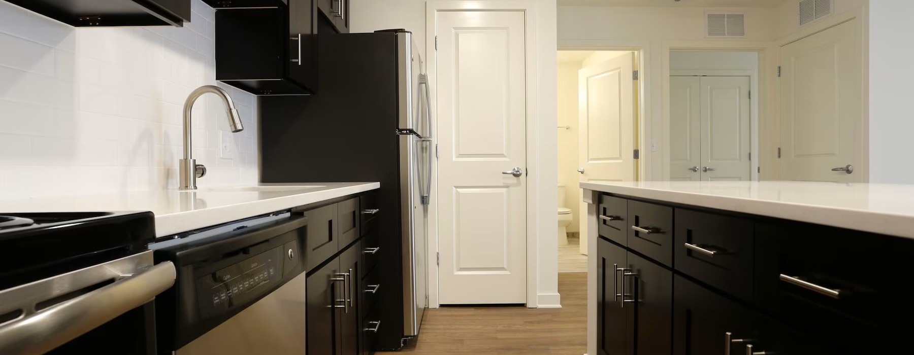a kitchen with black appliances