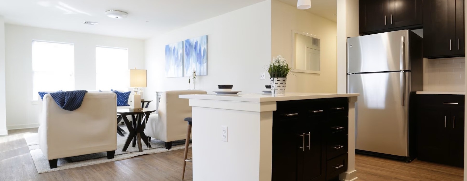 a large kitchen with a wood floor